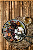 Salad with traditional italian burrata cheese, black arugula, grilled apricot, prosciutto, pistachio nuts and olive oil
