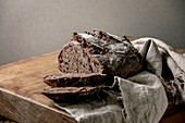 Sliced fresh baked artisan round homemade chocolate and cranberries rye bread