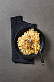 Cheese spaetzle with braised onions and pepper