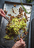 Vegetarian zucchini pasta with mushrooms on baking tray