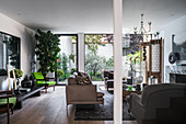Living room in earthy shades with access to courtyard garden