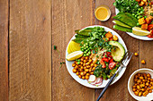 Healthy vegetarian lunch bowl with avocado, chickpeas, quinoa, microgreens and vegetables