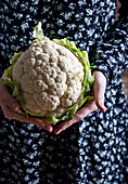 Woman holding cauliflower