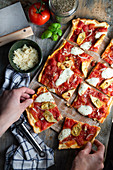 Vegetarian pizza with artichokes, mozzarella, oregano and onions