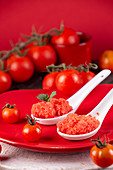 Spoons of fresh tomato sorbet