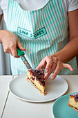 Woman amarena cherry and almond tart