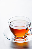 Glass cup of aromatic hot tea