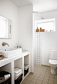 Masonry washstand in white bathroom