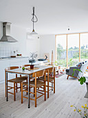 Dining area and kitchen counter with lounge area in background