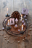 Original Advent wreath with miniature paper fir trees in white and natural shades