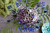 Bouquet of agapanthus, hydrangea, sea holly and fern leaves