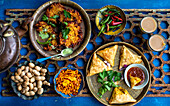 Indian street food - vegetable samosas, peanuts, onion baji (onion fritters)