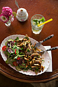 Fried cauliflower and mushrooms with a side salad