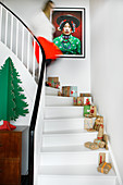 Wrapped gifts and Christmas decorations on white stairs