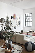 Small Christmas tree and gifts in vintage-style living room