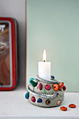 Handmade clay candle holder with colourful wooden beads