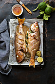 Oven-baked fish with kafir limes, lemons and chilli sauce