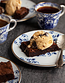 Chocolate brownies topped with salted caramel chocolate ice cream