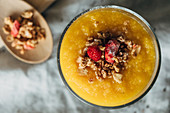 Mango compote with granola and freeze-dried alpine strawberries