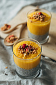 Chia and mango pudding with granola and freeze-dried alpine strawberries