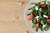Rocket salad with feta cheese, cashew nuts and tomatoes
