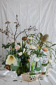 Spring bouquet of banksia, tulips, ranunculus, carnations, freesias, branches of magnolia and eucalyptus