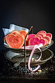 Heart-shaped biscuits on a cake stand