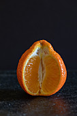 An orange, sliced