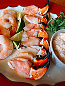 Crab claws and prawns with a dip