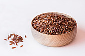 Red brown ermes rice in a wooden bowl