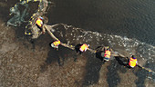 Scientists monitoring fish populations, aerial view