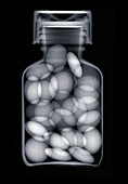Glass jar with pills, X-ray