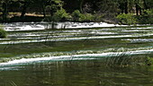 Water flowing over grass, Rog waterfall, Croatia