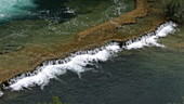 Skradin's waterfall flowing over cliff, Croatia