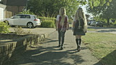 Schoolgirls walking to school, slo-mo