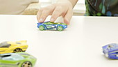 Boy playing with toy cars