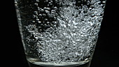 Water pouring into glass, slo-mo