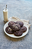 Chocolate cookies and a bottle of milk