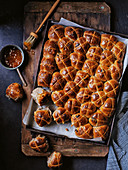 Salted peanut butter and jelly-glazed hot cross buns