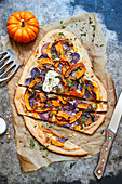 Tarte flambé with purple potatoes and red onions