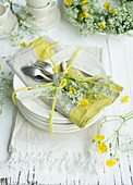 Arrangement of cow parsley and buttercups on plate for 60th birthday
