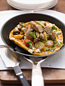 Omelette with a vegetable and sausage medley