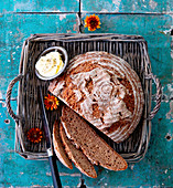 Spelt wholemeal bread with a dish of butter