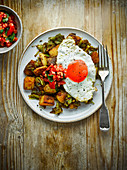 Healthy curried leek and potato hash with fried eggs