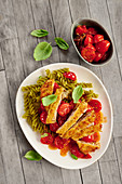 Escalope with tomatoes and fusilli