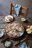 Apple and frangipane tart with almond flakes