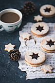 Christmas linzer cookies and a cup of coffee