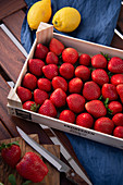 Fresh strawberries in a wooden crate