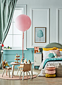 Balloon on the table in the pastel coloured children's room