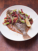 Plaice with bacon and spring onions
